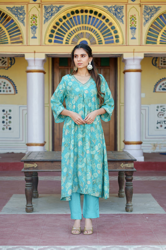 Women Muslin pleated kurta with bead work Neckline & Solid Bottom Set