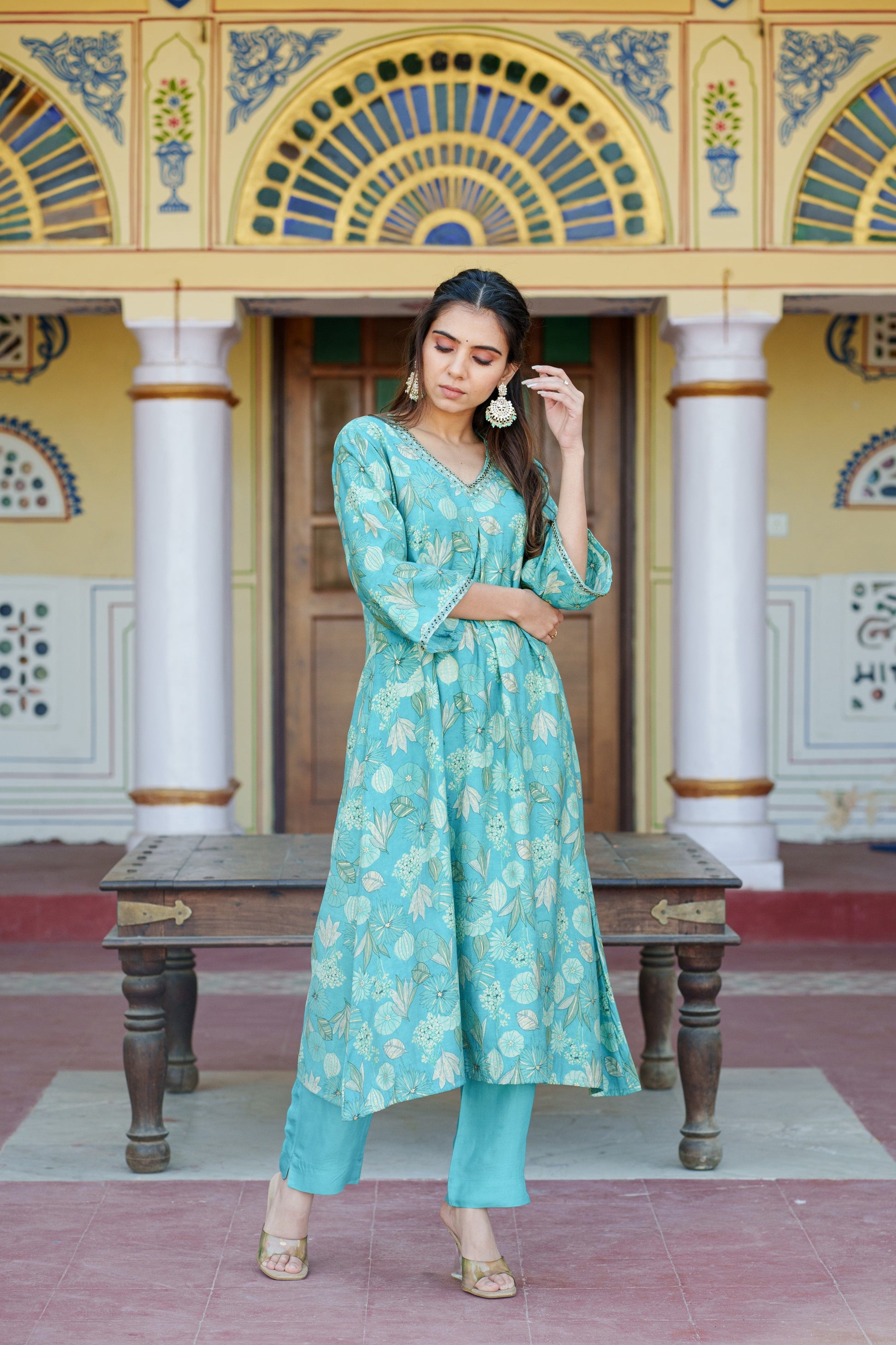 Women Muslin pleated kurta with bead work Neckline & Solid Bottom Set