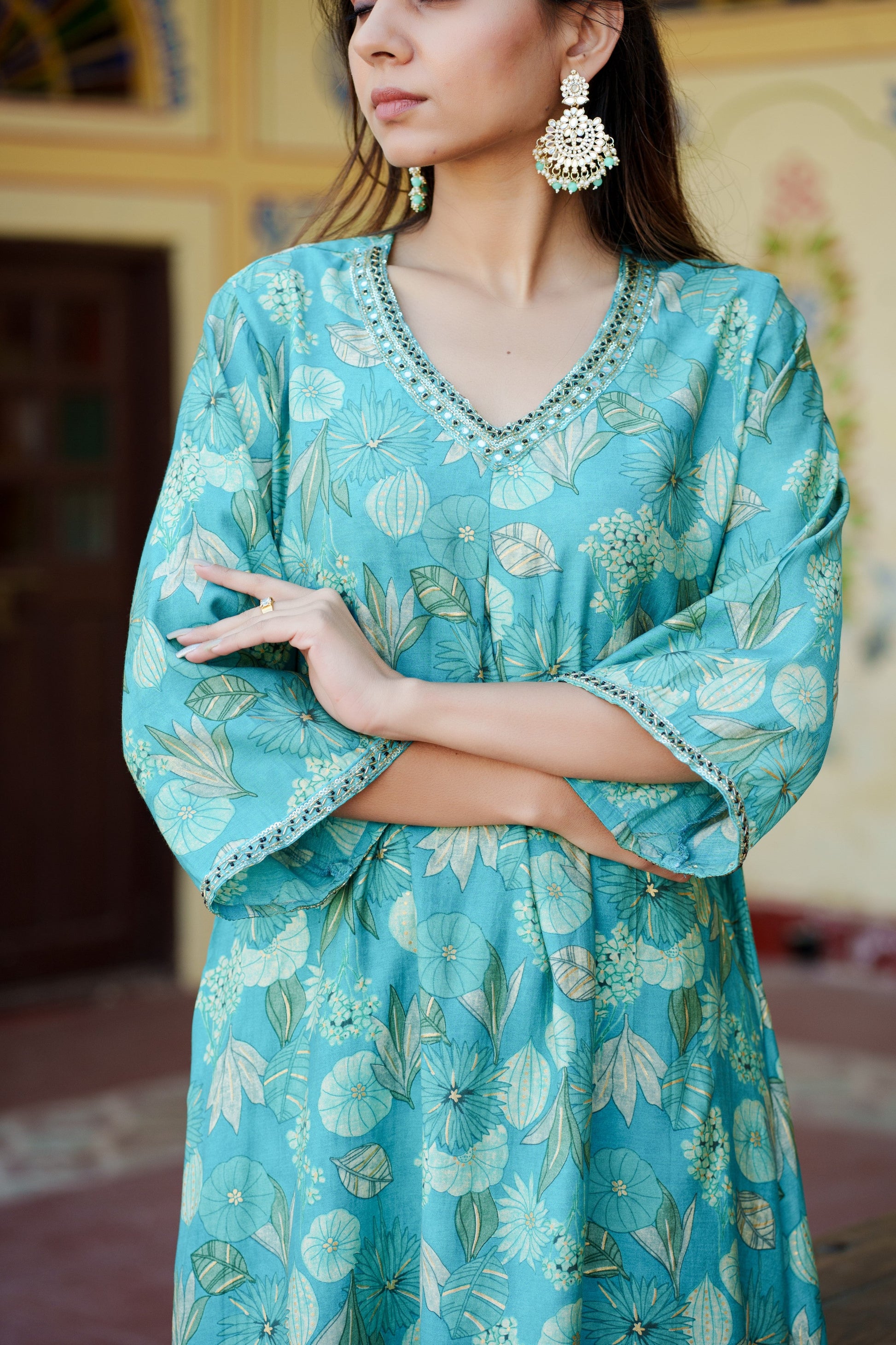 Women Muslin pleated kurta with bead work Neckline & Solid Bottom Set