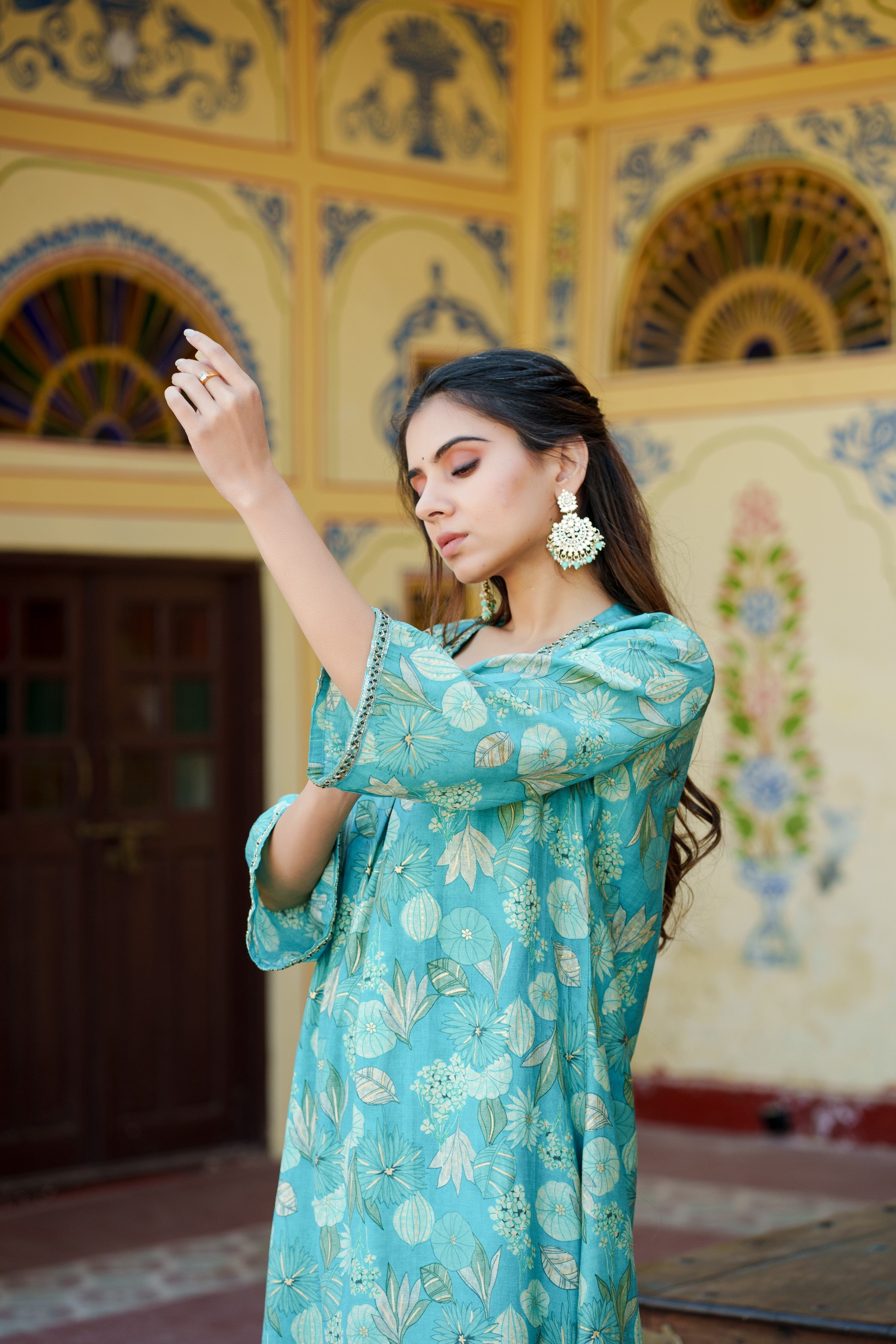 Women Muslin pleated kurta with bead work Neckline & Solid Bottom Set