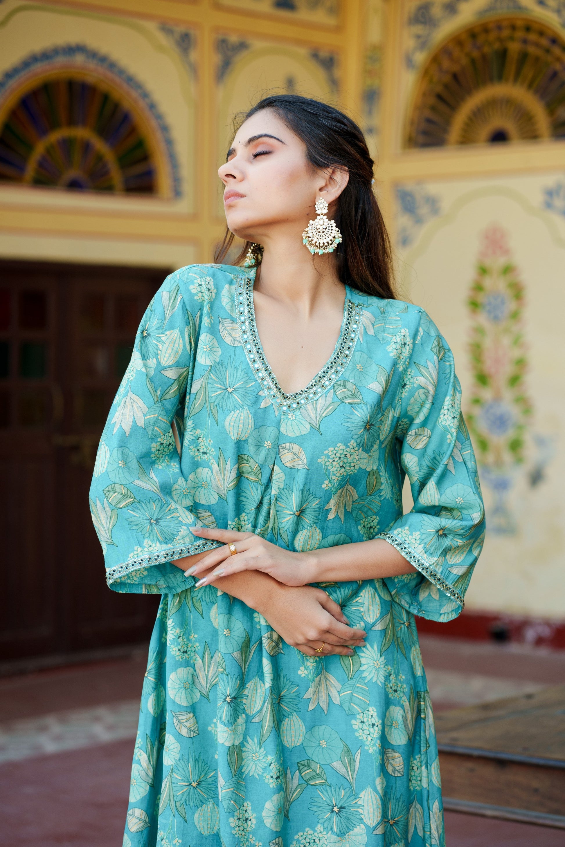 Women Muslin pleated kurta with bead work Neckline & Solid Bottom Set