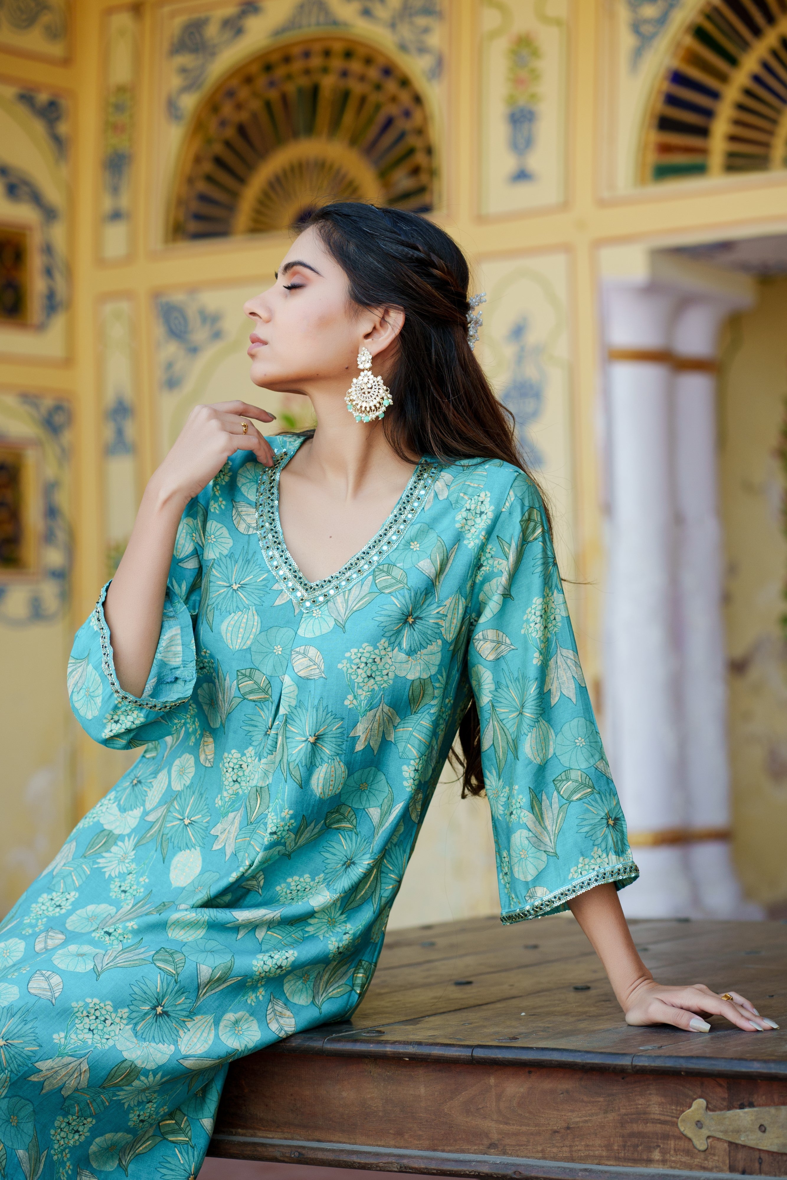Women Muslin pleated kurta with bead work Neckline & Solid Bottom Set
