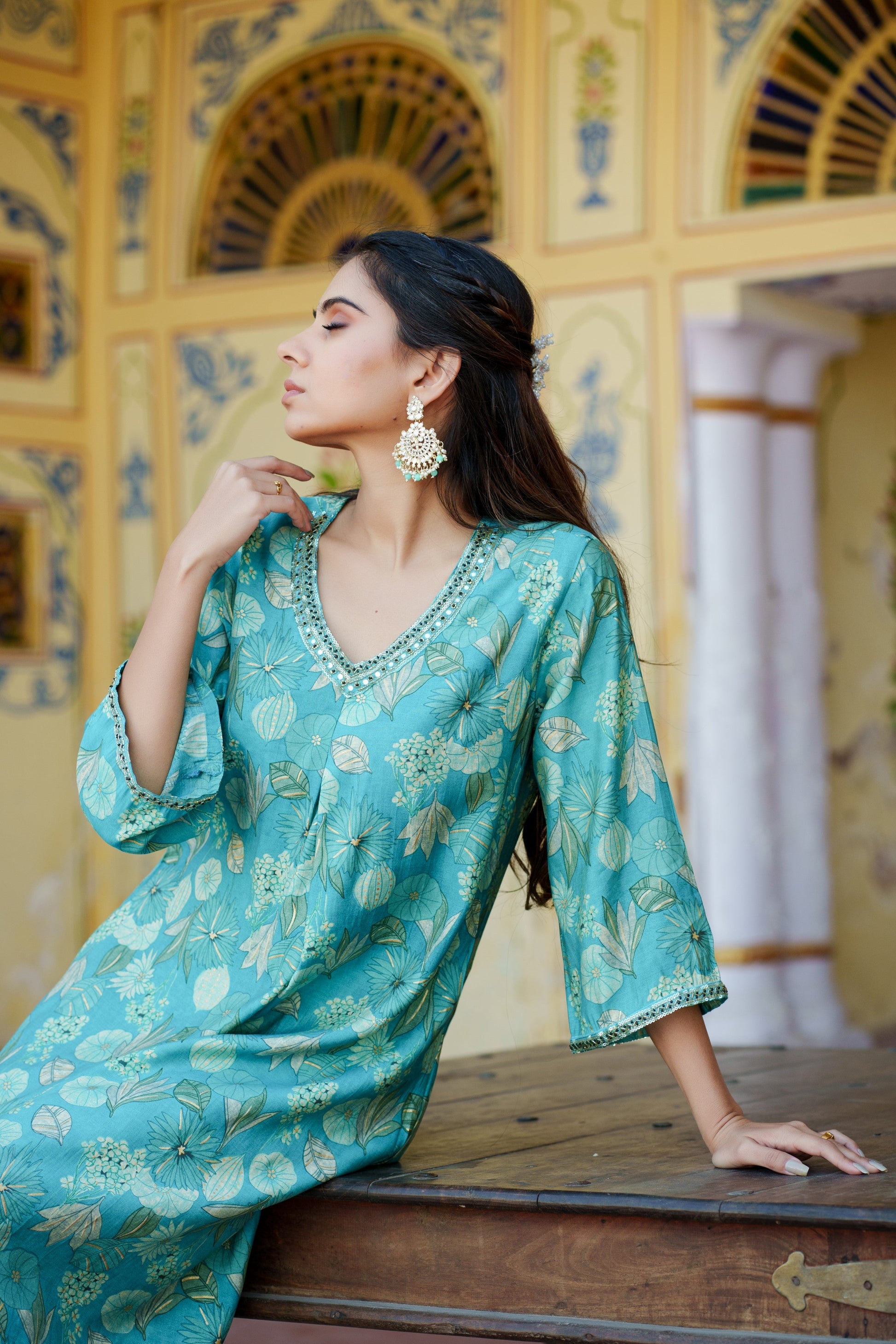 Women Muslin pleated kurta with bead work Neckline & Solid Bottom Set