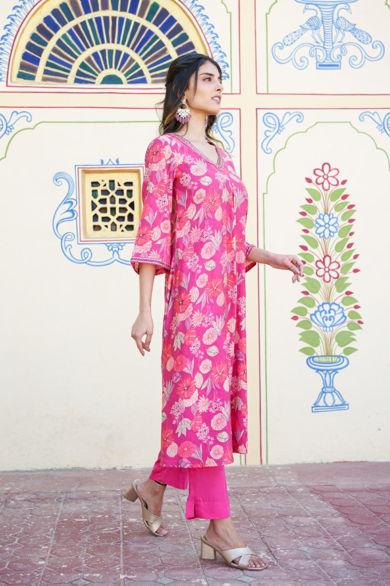 Women Muslin pleated kurta with bead work Neckline & Solid Bottom Set