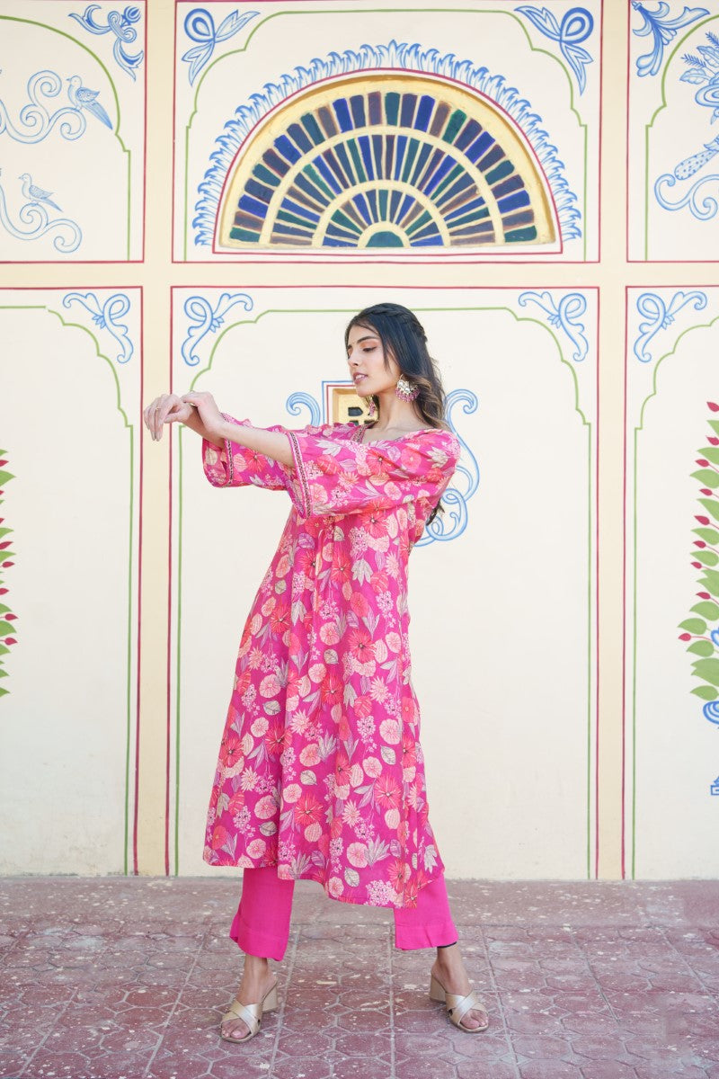Women Muslin pleated kurta with bead work Neckline & Solid Bottom Set