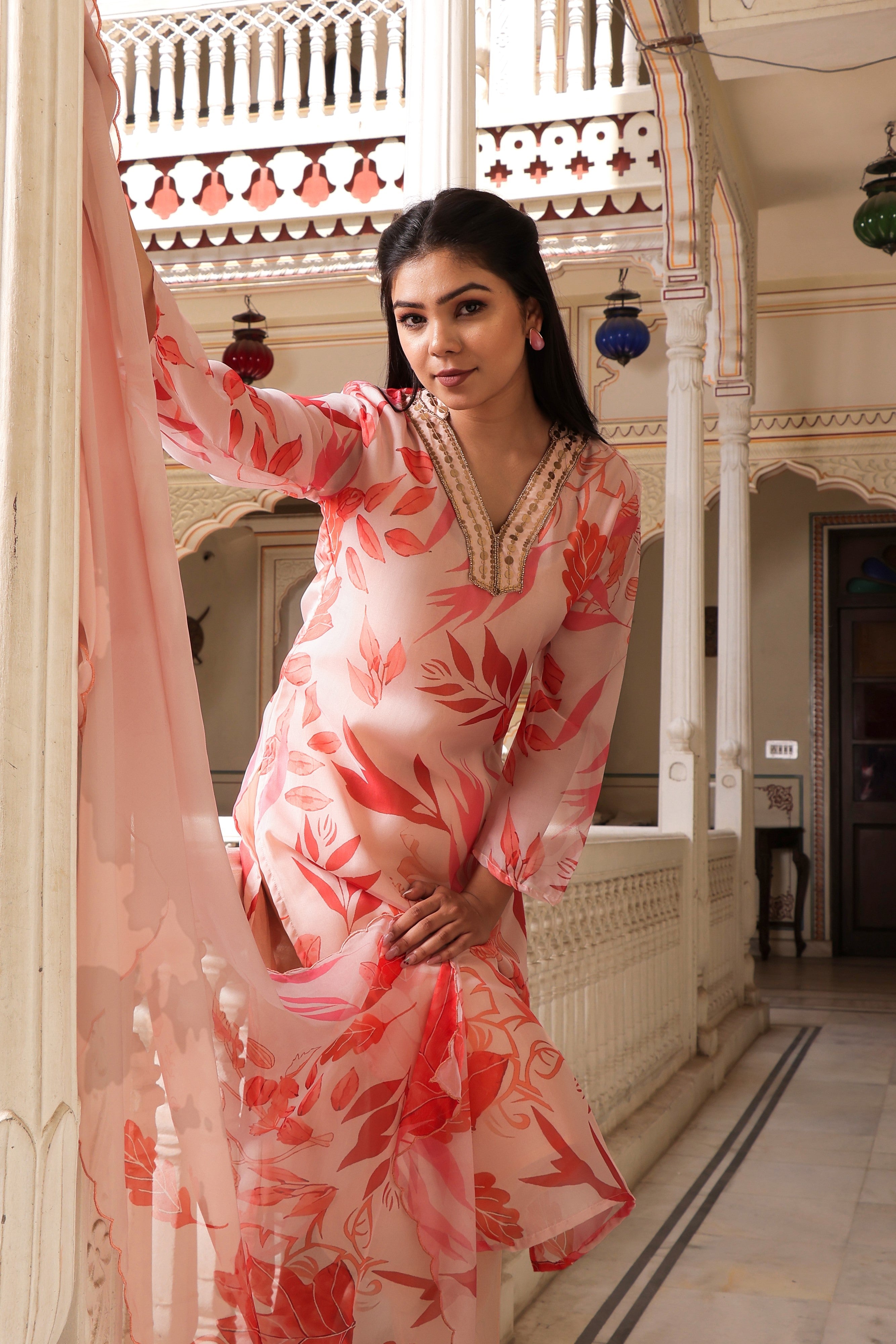 Peach Placement print collared Straight suit set with solid bottom & printed organza cut work dupatta set.