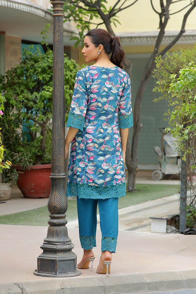 Women cyan embroidered printed  kurta set with laced solid pants